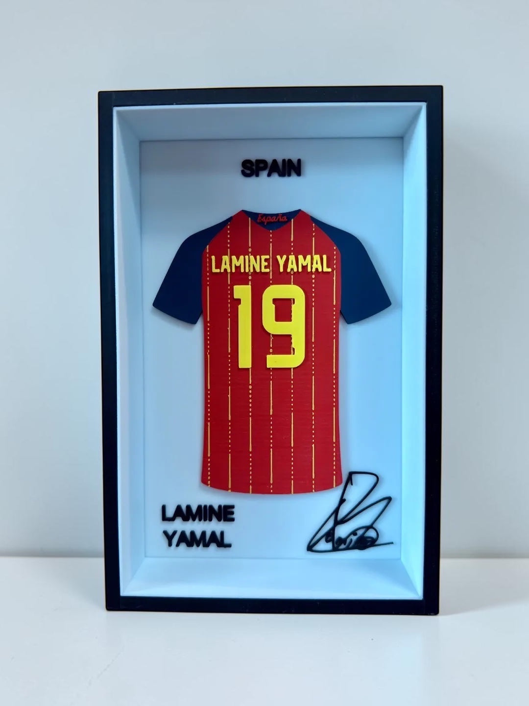 Kitly framed 3D Spain Lamine Yamal football jersey display with number 19 and signature in a sleek black frame