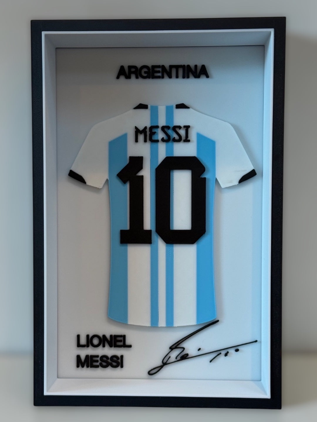 Kitly 3D frame featuring a white and blue Argentina Messi number 10 football jersey with signature and relief text.